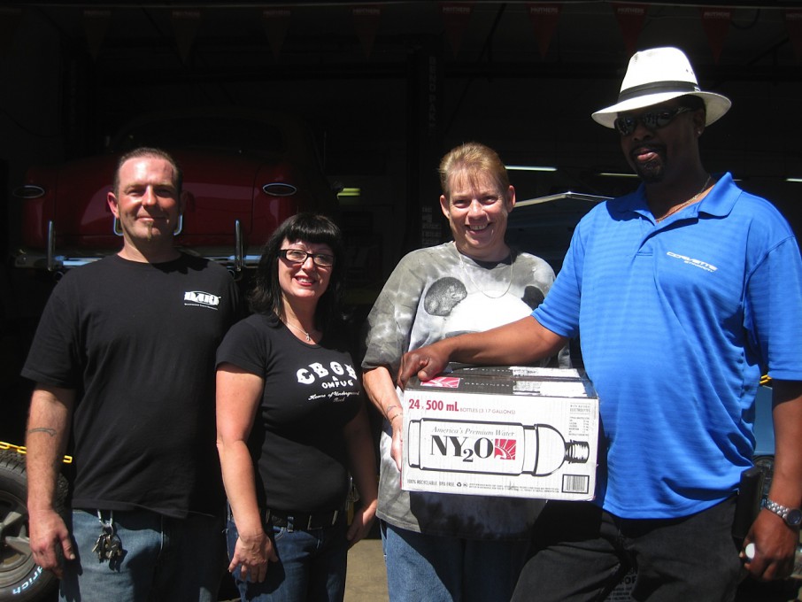 Robert Banks, right, and Norma Dickerson, middle-right, won cases of NY2O.